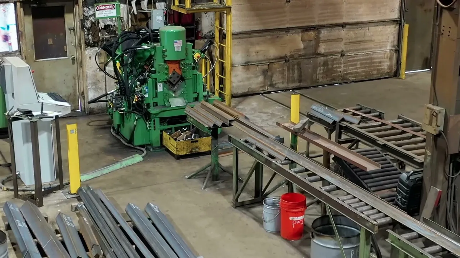 Anglemaster work area with angle stock on the infeed racks