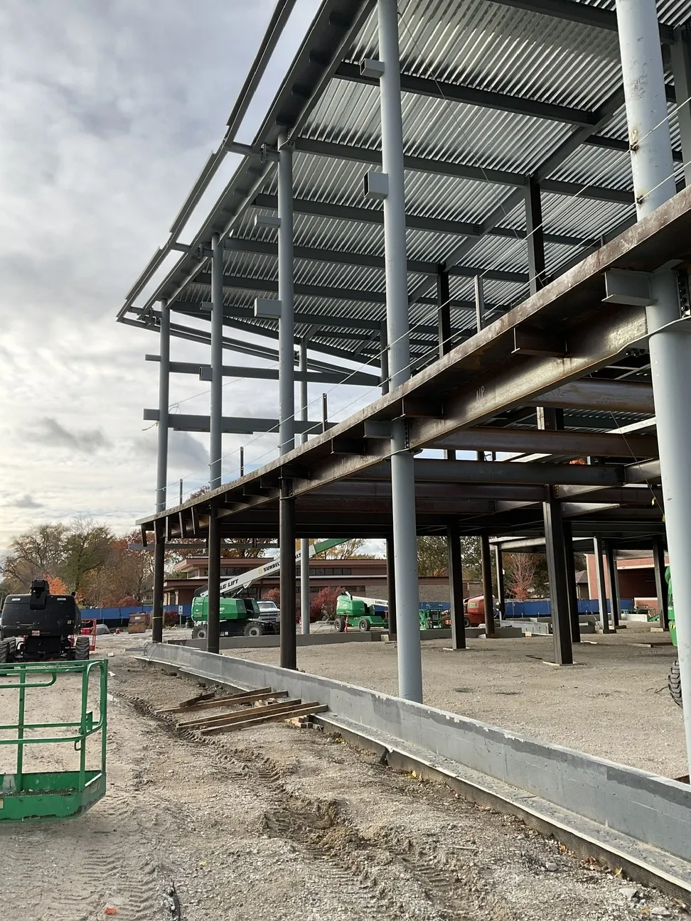 Aurora University Learning Commons: decked floors and round columns along the curved edge of the building