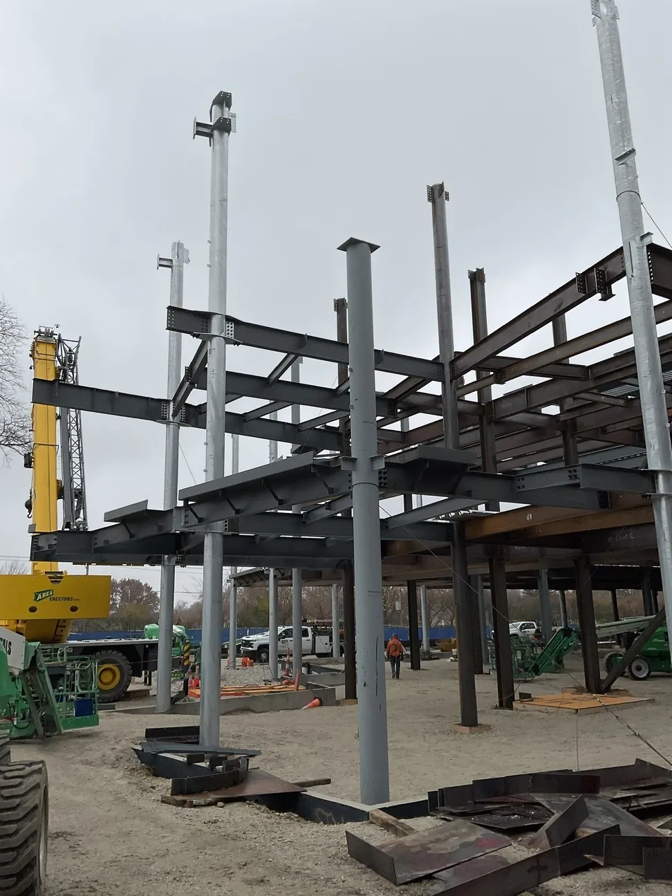 Aurora University Learning Commons: columns and floor framing going up, with steel staged in the foreground