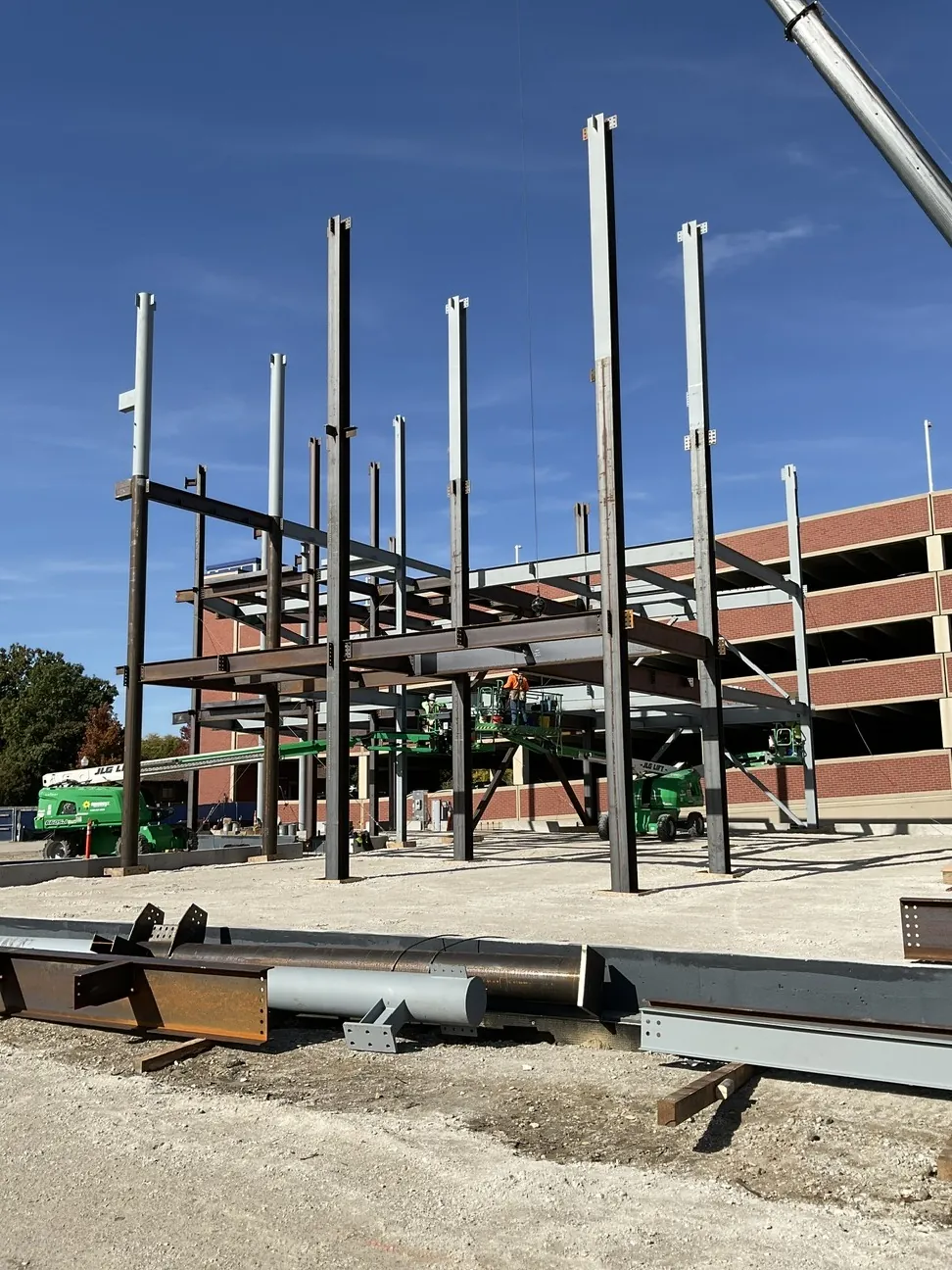 Aurora University Learning Commons: columns and the first floor beams rising beside the parking structure
