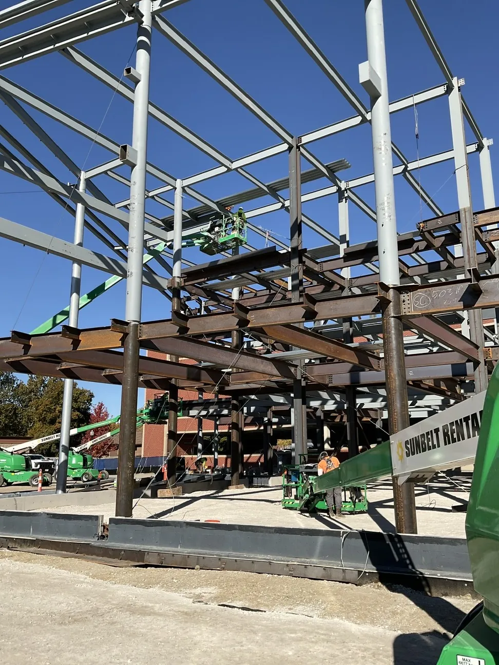 Aurora University Learning Commons: looking up through the floor framing to the round columns and roof steel