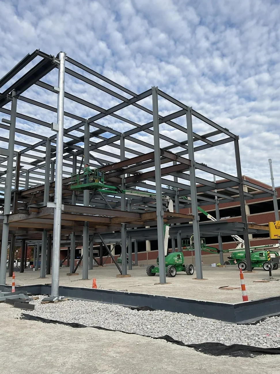 Aurora University Learning Commons: the corner of the frame against a clouded sky