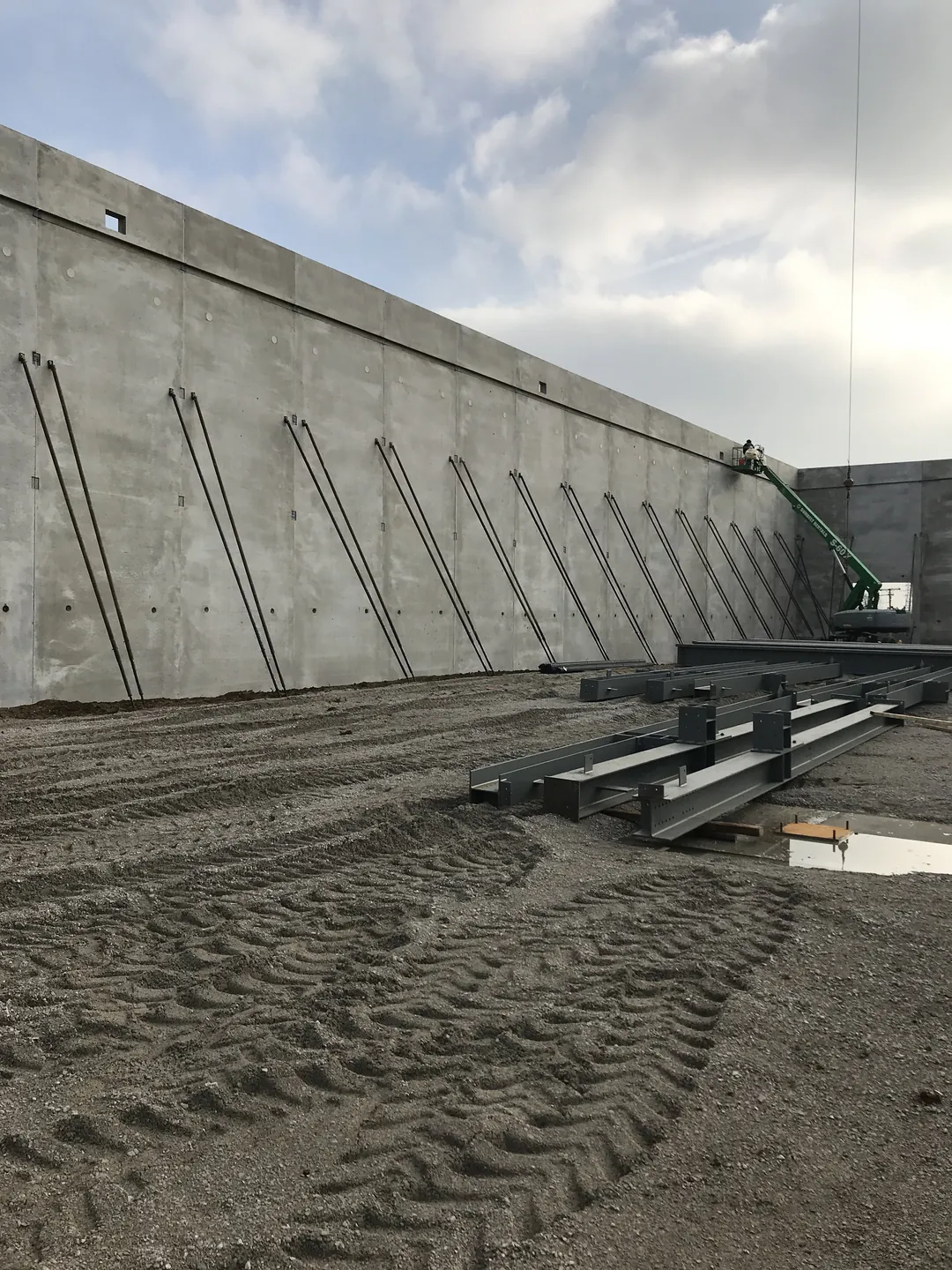 Bulldog Cartage: steel members staged on the ground beside the braced tilt-up concrete walls