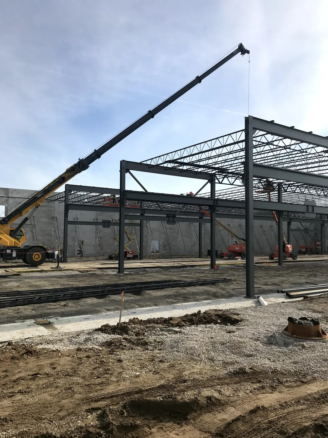 Bulldog Cartage: a crane lifting a beam onto the end frame