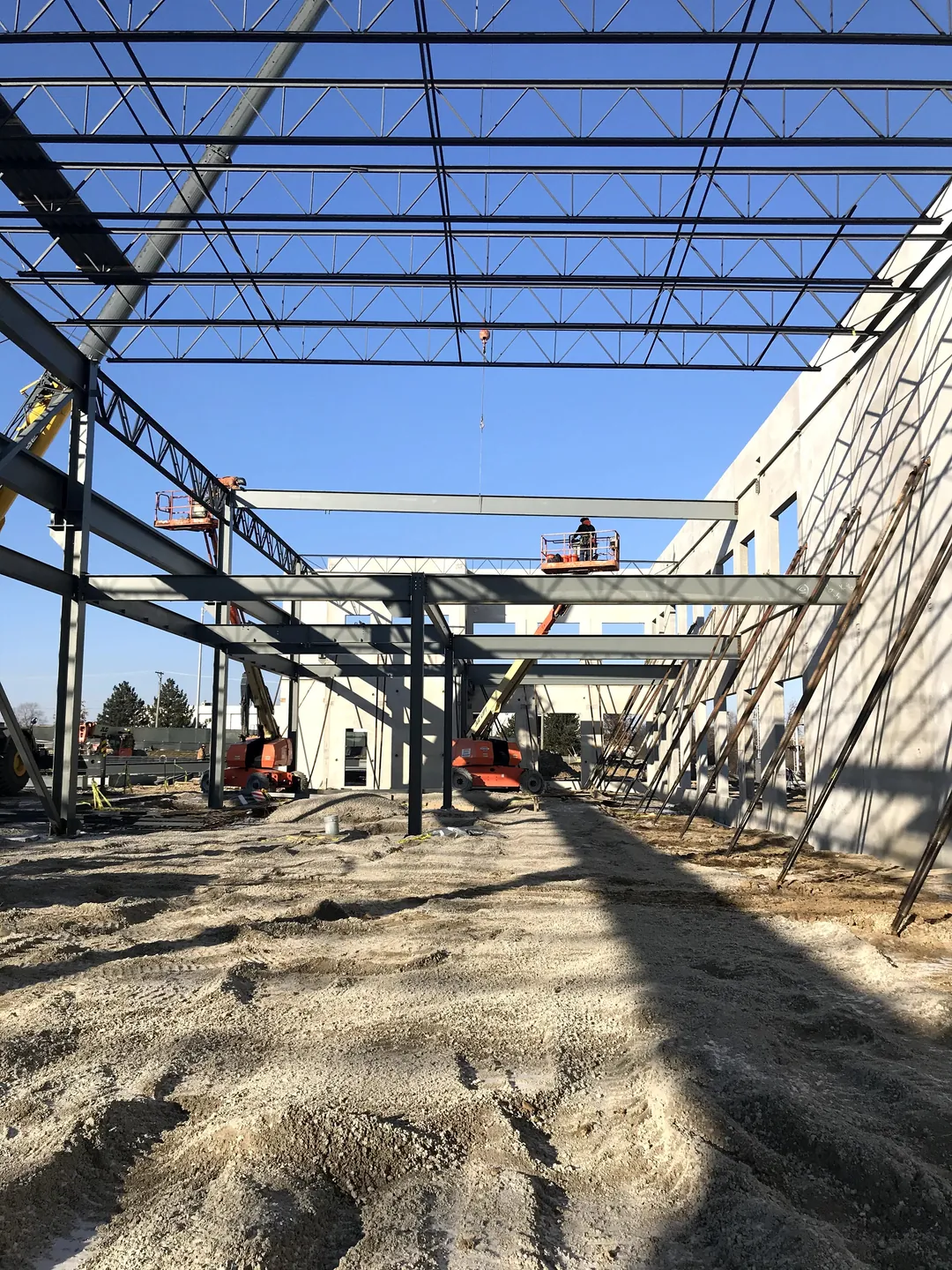 Bulldog Cartage: beams and joists along the tilt-up wall, with lifts at the far end