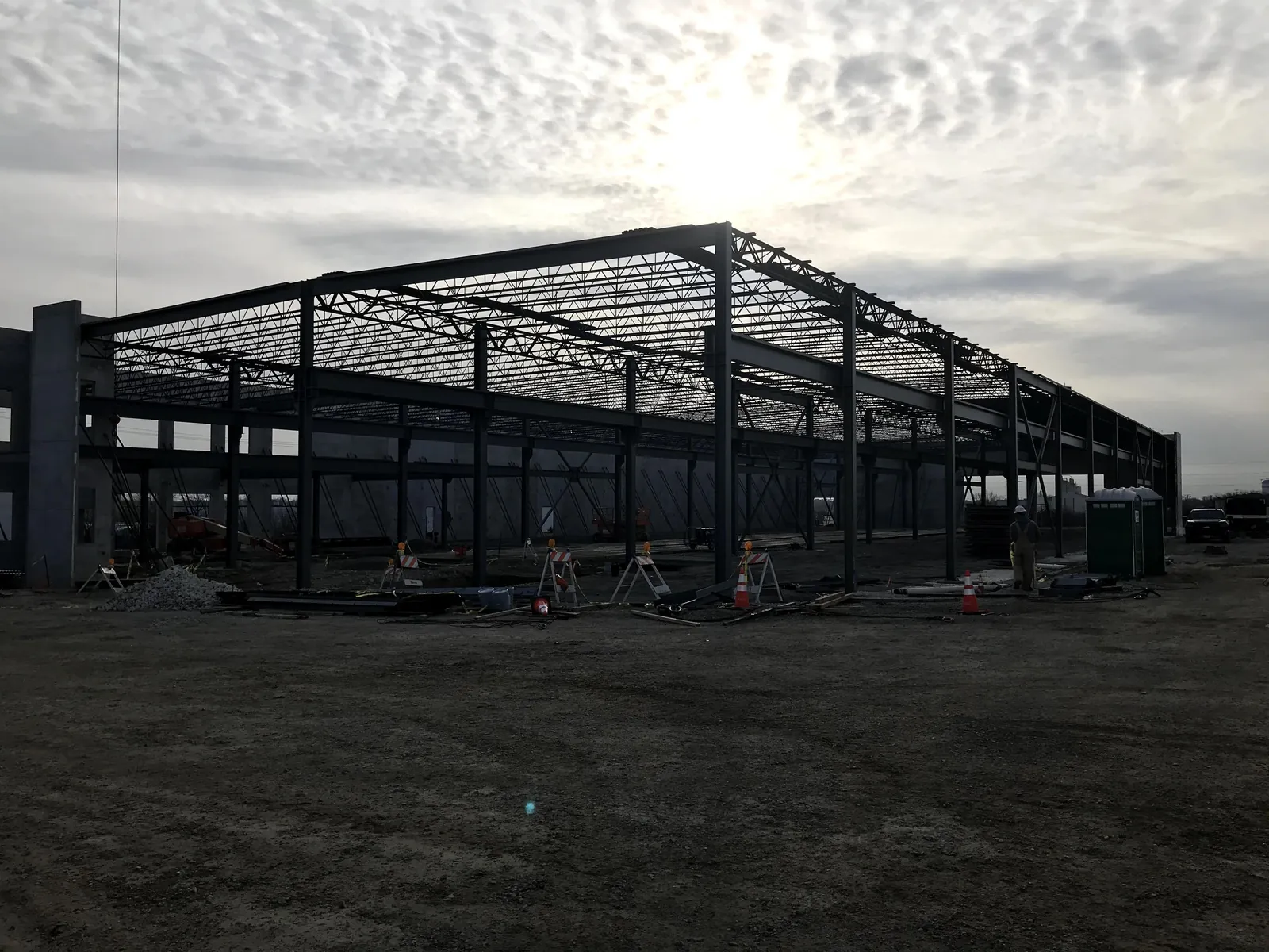 Bulldog Cartage: the building frame against the evening sky