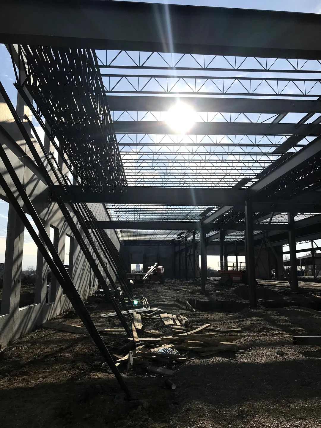 Bulldog Cartage: looking down the building under the roof joists, with the sun overhead