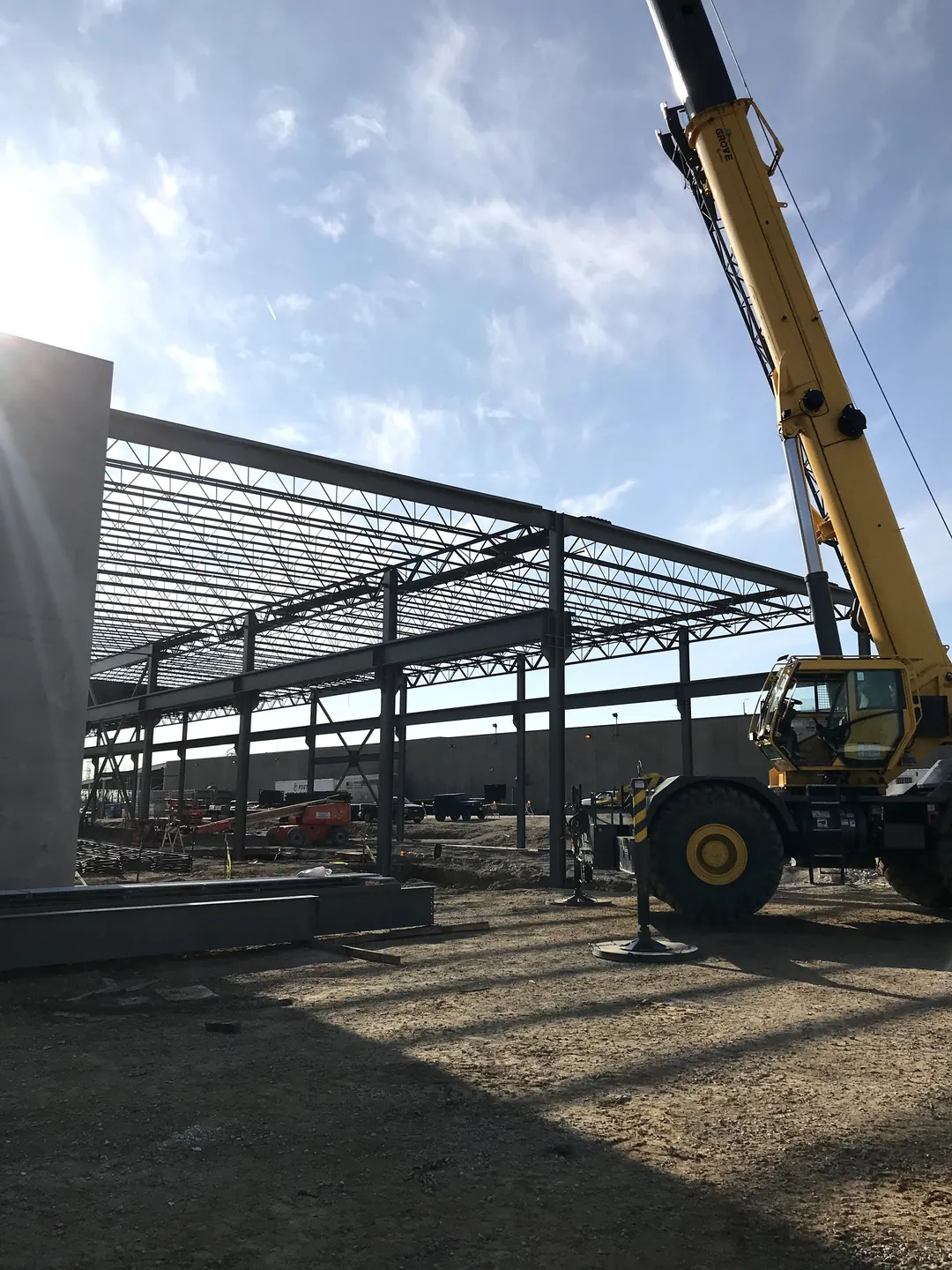 Bulldog Cartage: a crane at the end of the building beside the tilt-up wall