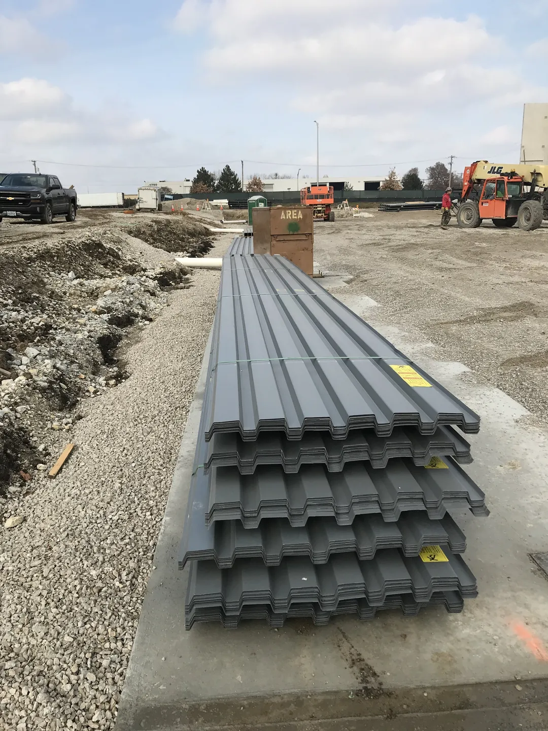 Bulldog Cartage: bundles of steel roof deck stacked on site