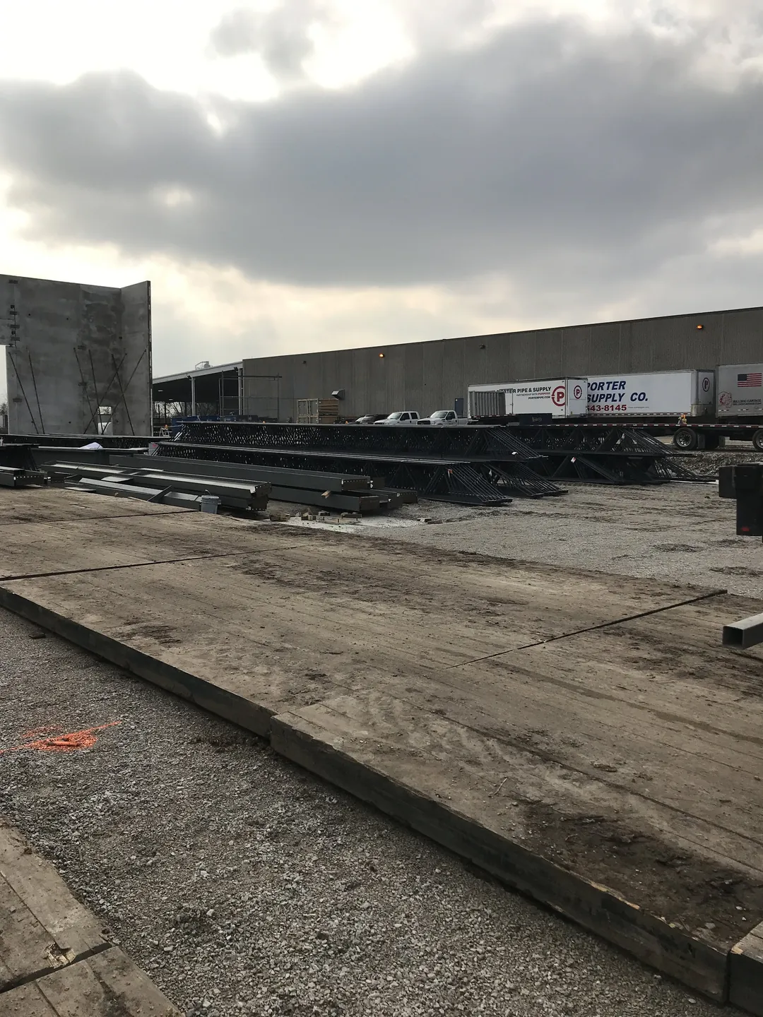 Bulldog Cartage: steel staged across the site, with parked trailers behind