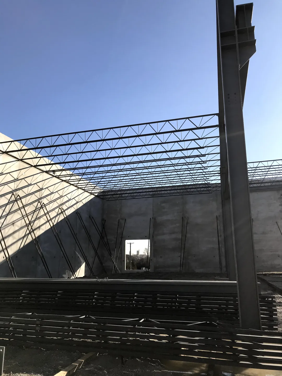 Bulldog Cartage: a steel column rising against the tilt-up walls under the first roof joists