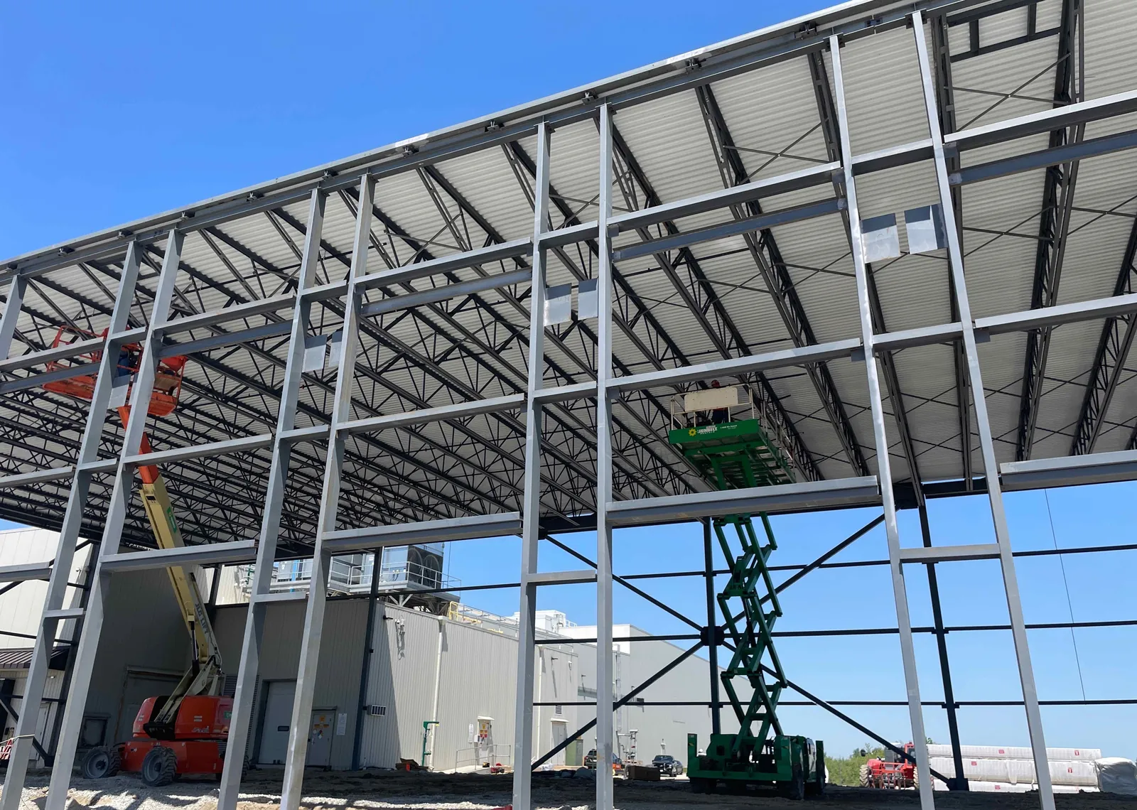 DOT Foods: wall girts and the decked roof, with a scissor lift at work