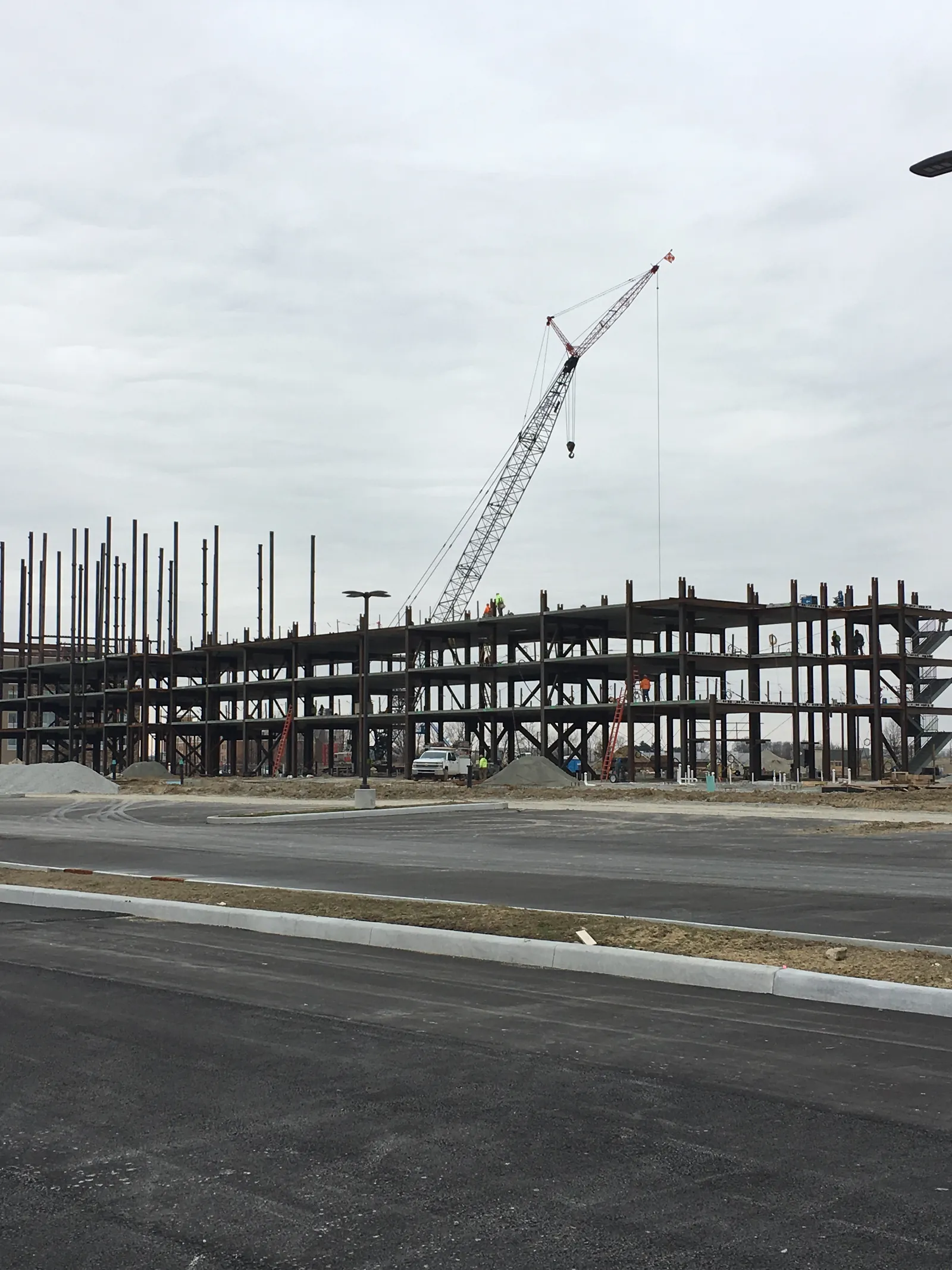 Embassy Suites multi-story steel frame with a tower crane
