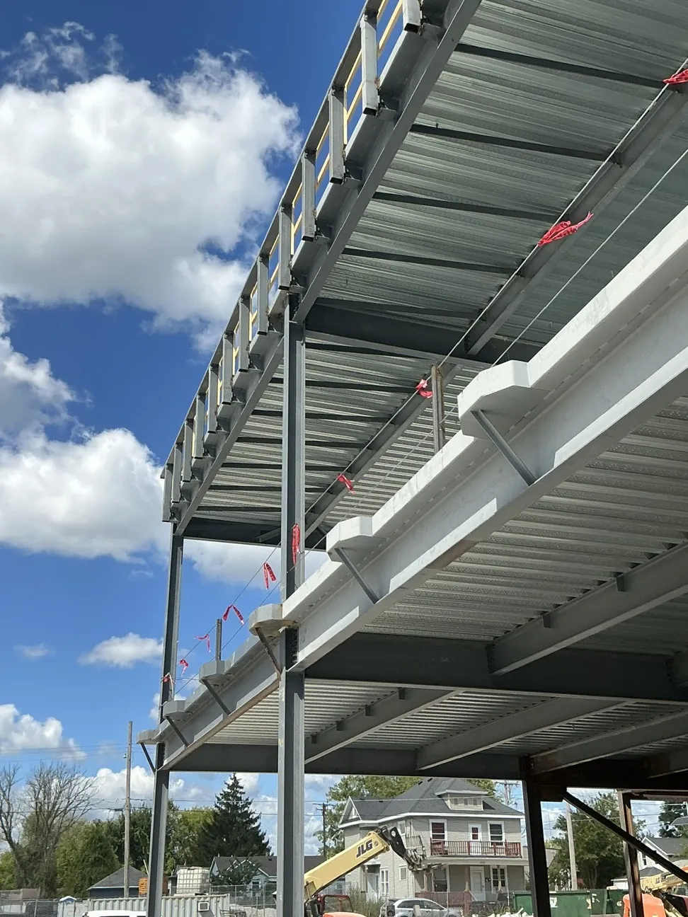 Lincoln King Center: looking up at the decked floors and the railing posts at the roof edge