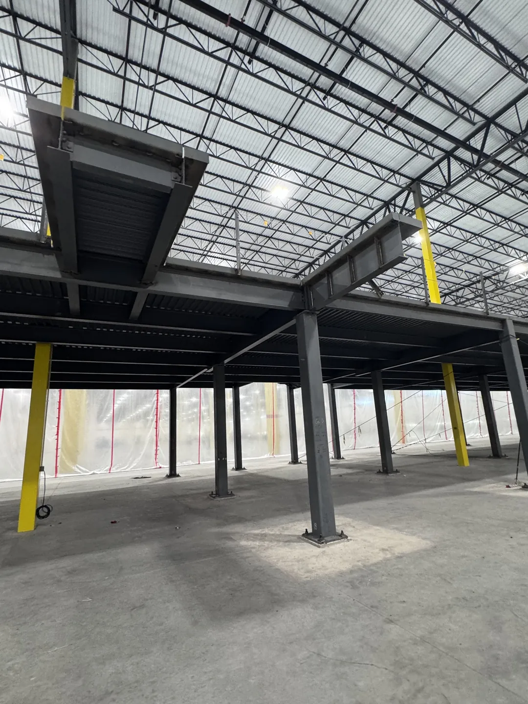 Project Maverick: mezzanine beams, deck and columns on the warehouse floor