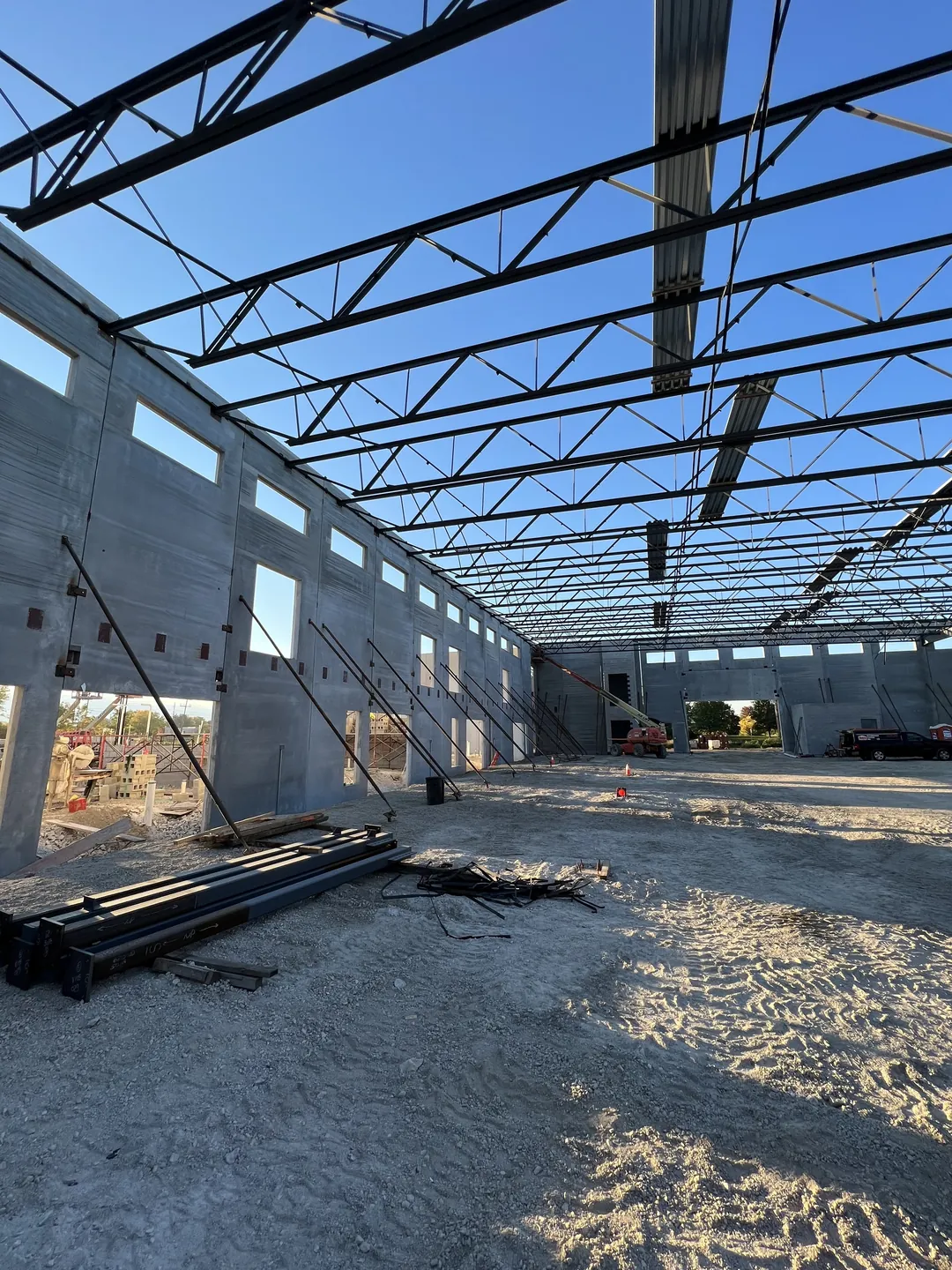 Montgomery Public Works: roof joists and joist girders over the long bay, with steel staged at left