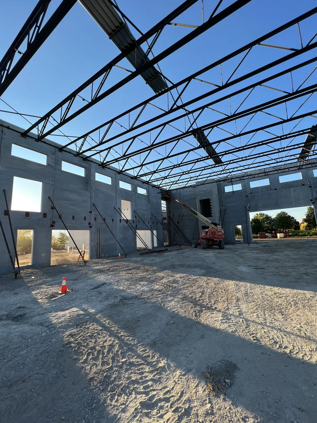 Montgomery Public Works: the joist roof and braced precast walls, with a boom lift at work