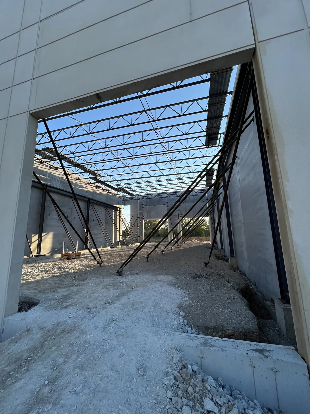 Montgomery Public Works: the roof framing seen through an opening in the precast wall