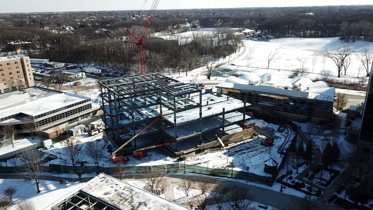 Midwestern University Support Services Building: aerial view of the Support Services Building frame in winter, with the Midwestern University campus around it
