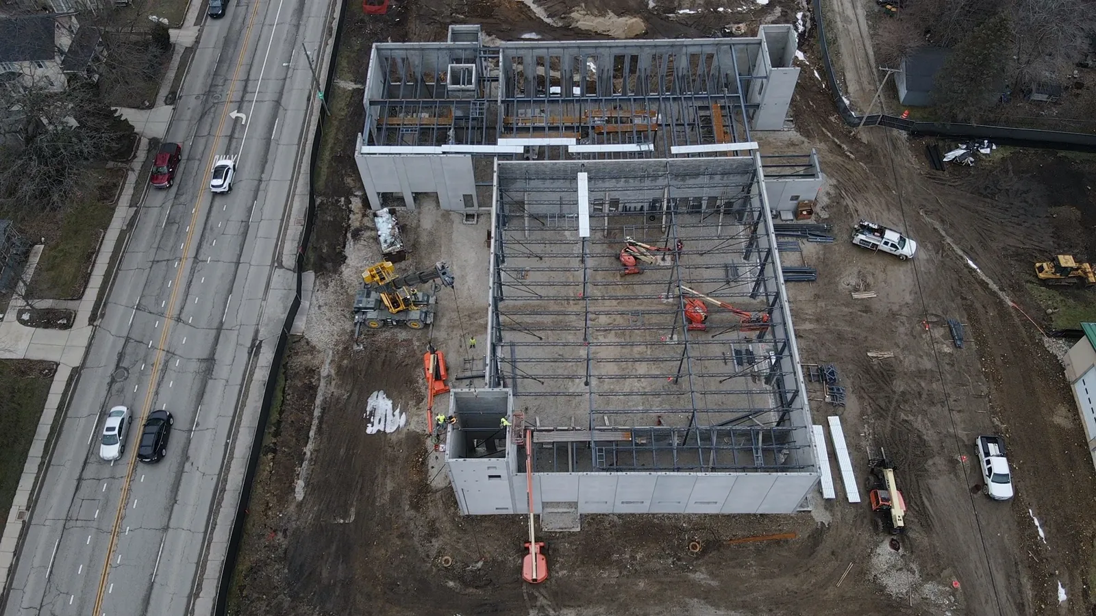 North Aurora Fire District Headquarters: aerial view of the building from the street side, with roof steel going in