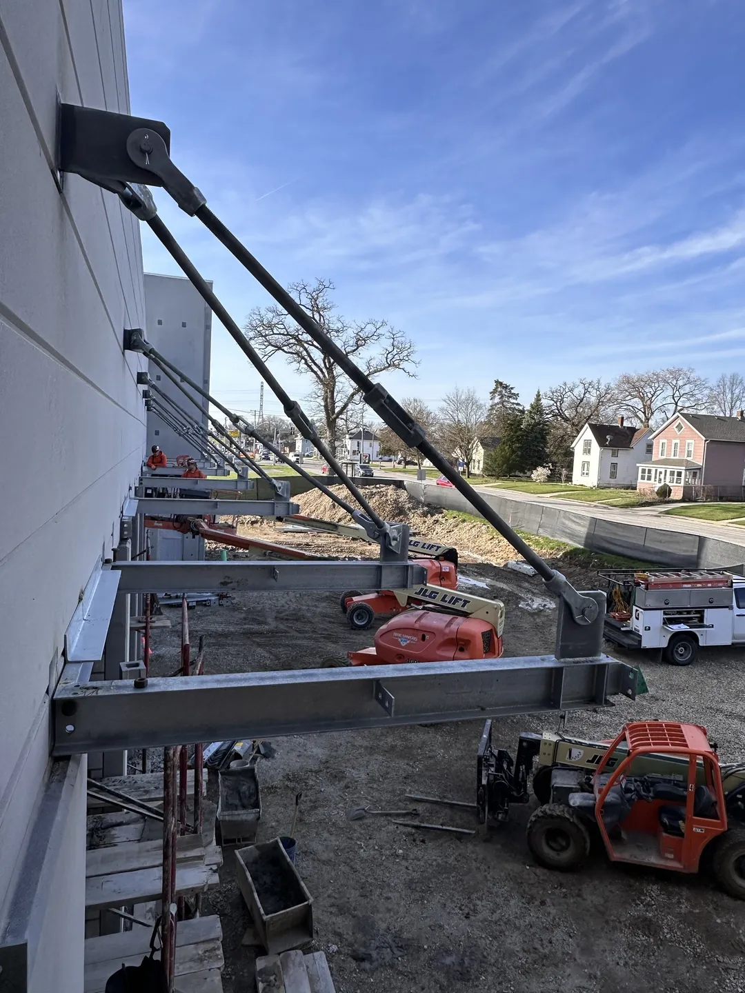 North Aurora Fire District Headquarters: canopy beams hung from the precast wall on tie rods