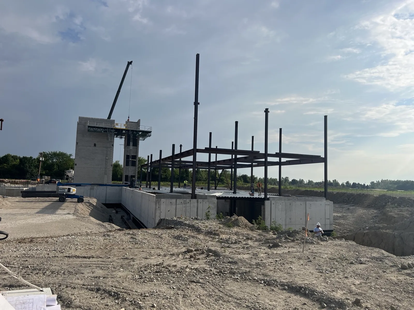 Northwest Community Cancer Center: columns and the first beams going up beside the masonry stair tower