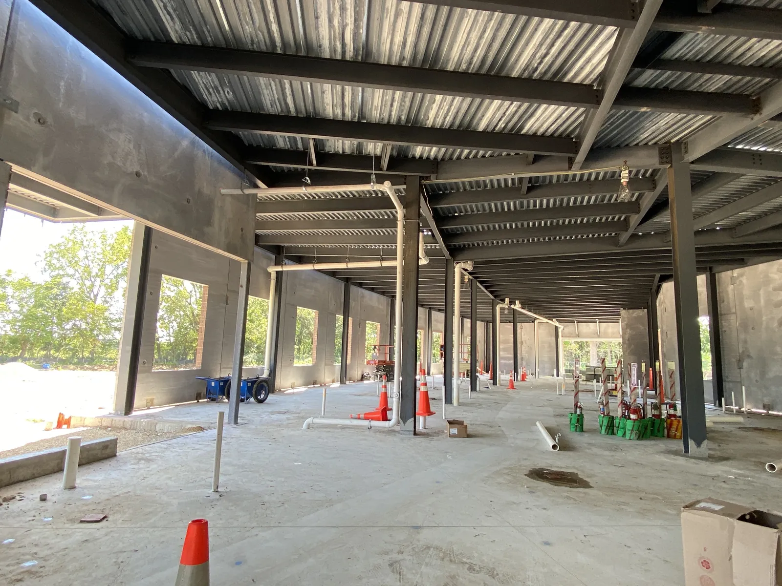 OrthoWisconsin Ambulatory: inside the building under the decked roof, with columns along the window wall