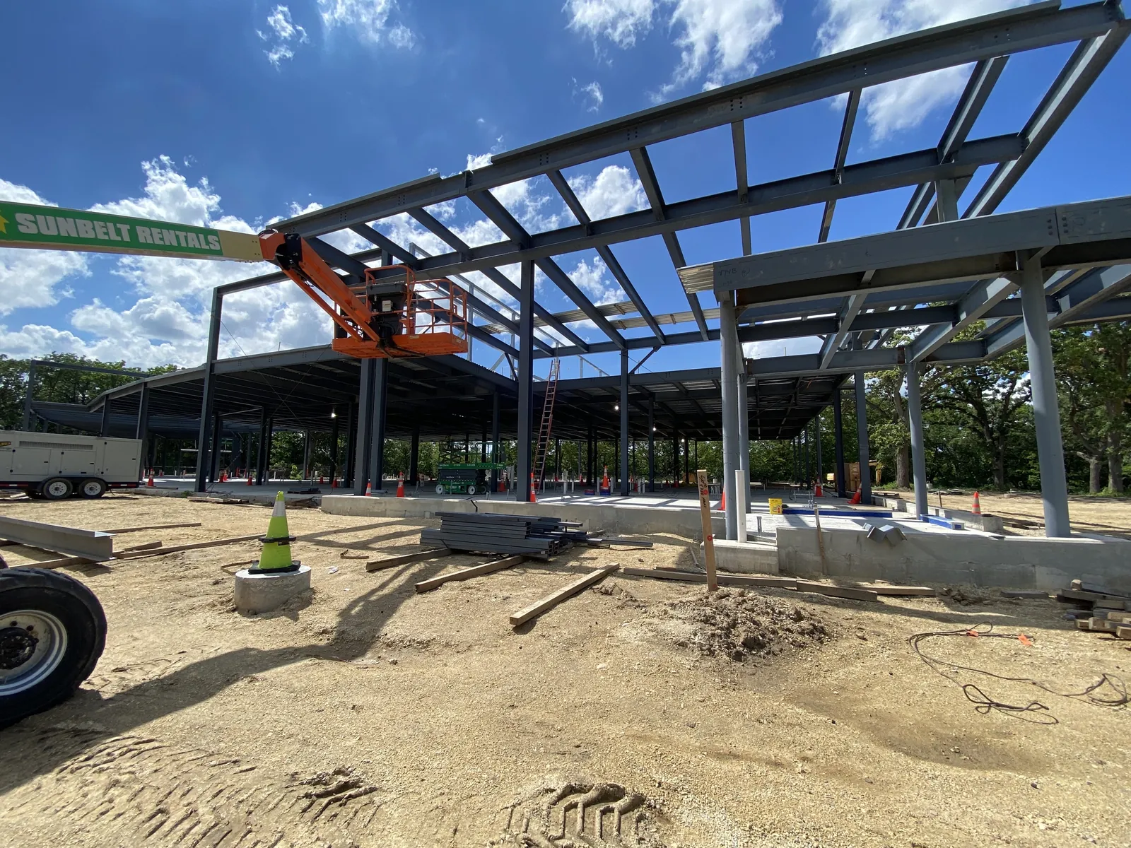 OrthoWisconsin Ambulatory: roof beams over the entrance, with a boom lift at work